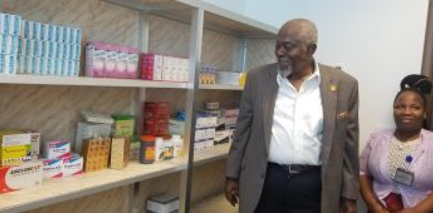 Exe. Gov. Patray inspecting newly opened health office, escorted by nurse