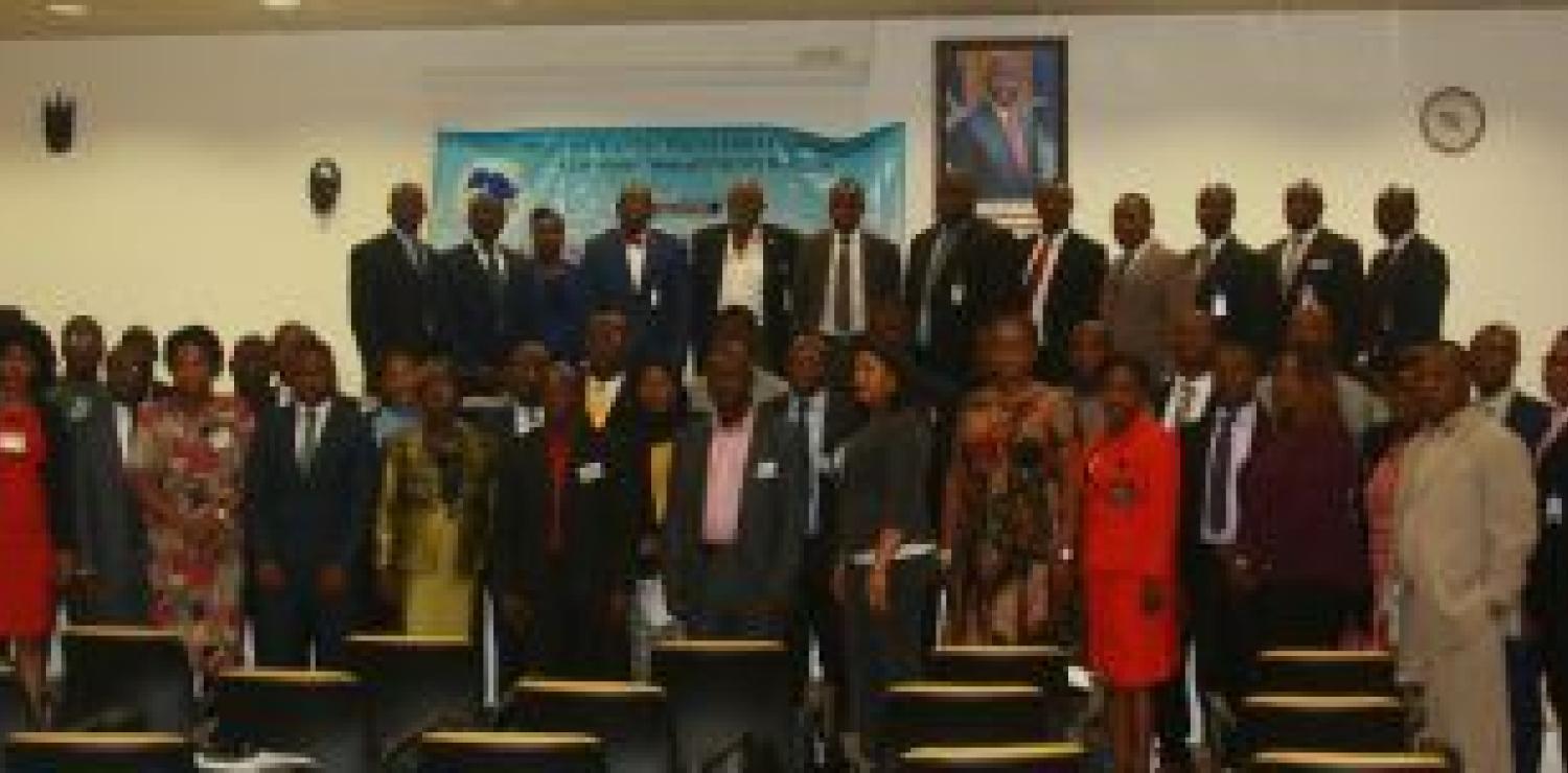 Exe. Gov Patray (5th from left) flanked by DG Siaplay (L) and Officer-In-Charge for Operations, Allison, WAIFEM officials and workshop participants