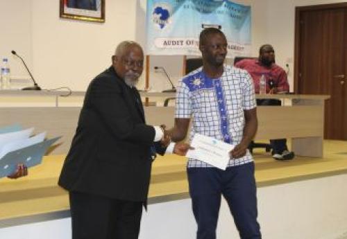 CBL Executive Governor, Patray Presenting Certificate to Participant.