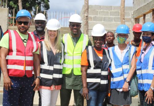 EG Tarlue (middle) sandwiched by USAID and Bong Co. officials Photo Credit: CBL