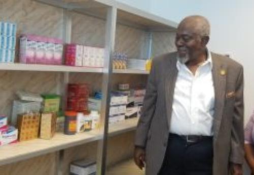 Exe. Gov. Patray inspecting newly opened health office, escorted by nurse