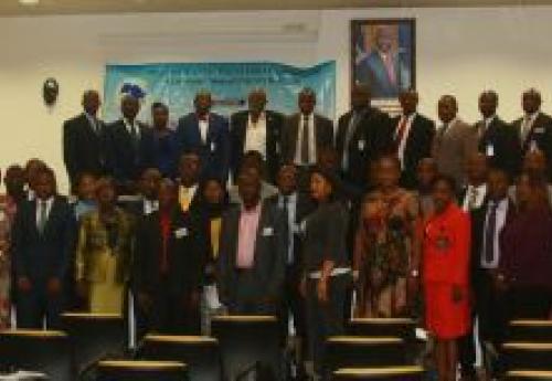 Exe. Gov Patray (5th from left) flanked by DG Siaplay (L) and Officer-In-Charge for Operations, Allison, WAIFEM officials and workshop participants