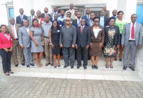 Gov. Weeks (middle) in photo with participants