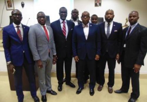 Dr. Siaplay (center), with insurance executives